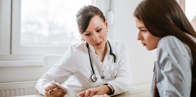 Doctor giving advice to a female patient.